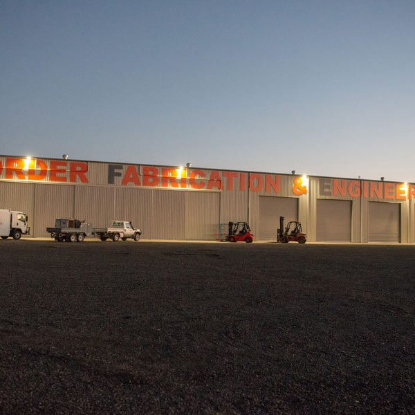 Glen Carrigan Border Fabrication and Engineering Logo Outside Workshop at night
